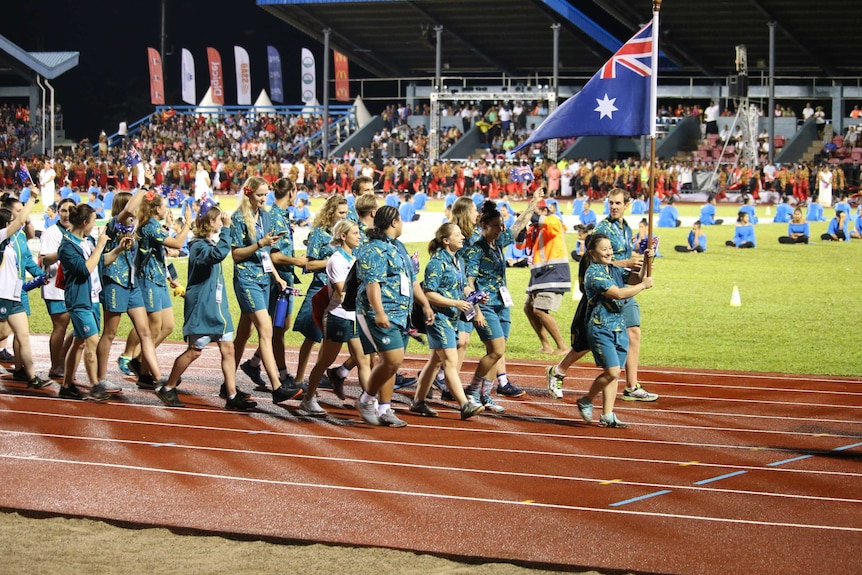 The Australian team walks through the opening ceremony at the Pacific Games