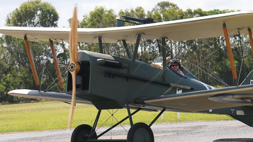 Andrew Carter lands a replica WWI plane.