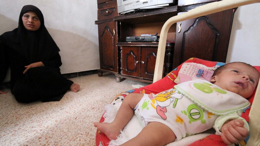 Syrian mum with rescued baby