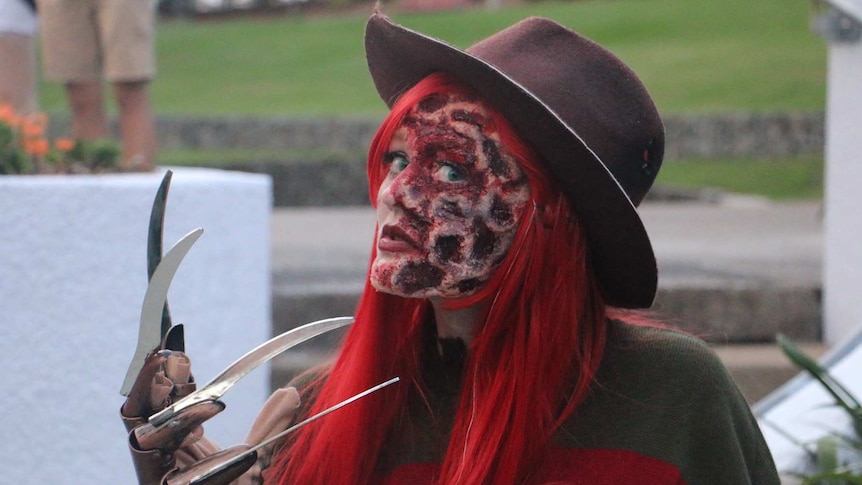 A woman dresses up as horror film character Freddy Krueger at the Brisbane Zombie Walk on November 1, 2015.