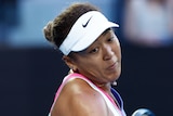 A Japanese female tennis player hits a forehand at the Australian Open.