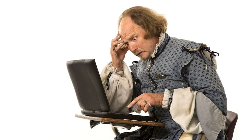 A worried looking Shakespeare sits at a laptop