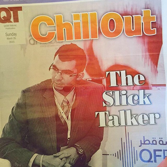 Newspaper article showing photo of man with headphones and headline 'The Slick Talker'.