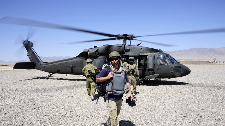 Thom Cookes arrives at Forward Operating Base Hadrian by United States' Black Hawk helicopter