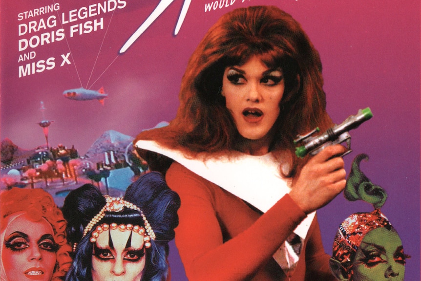 A movie poster for Vegas in Space written at top and a drag queen holding a gun with three other drag qeens with red and green f
