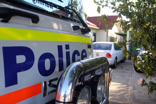 A police van outside a house.