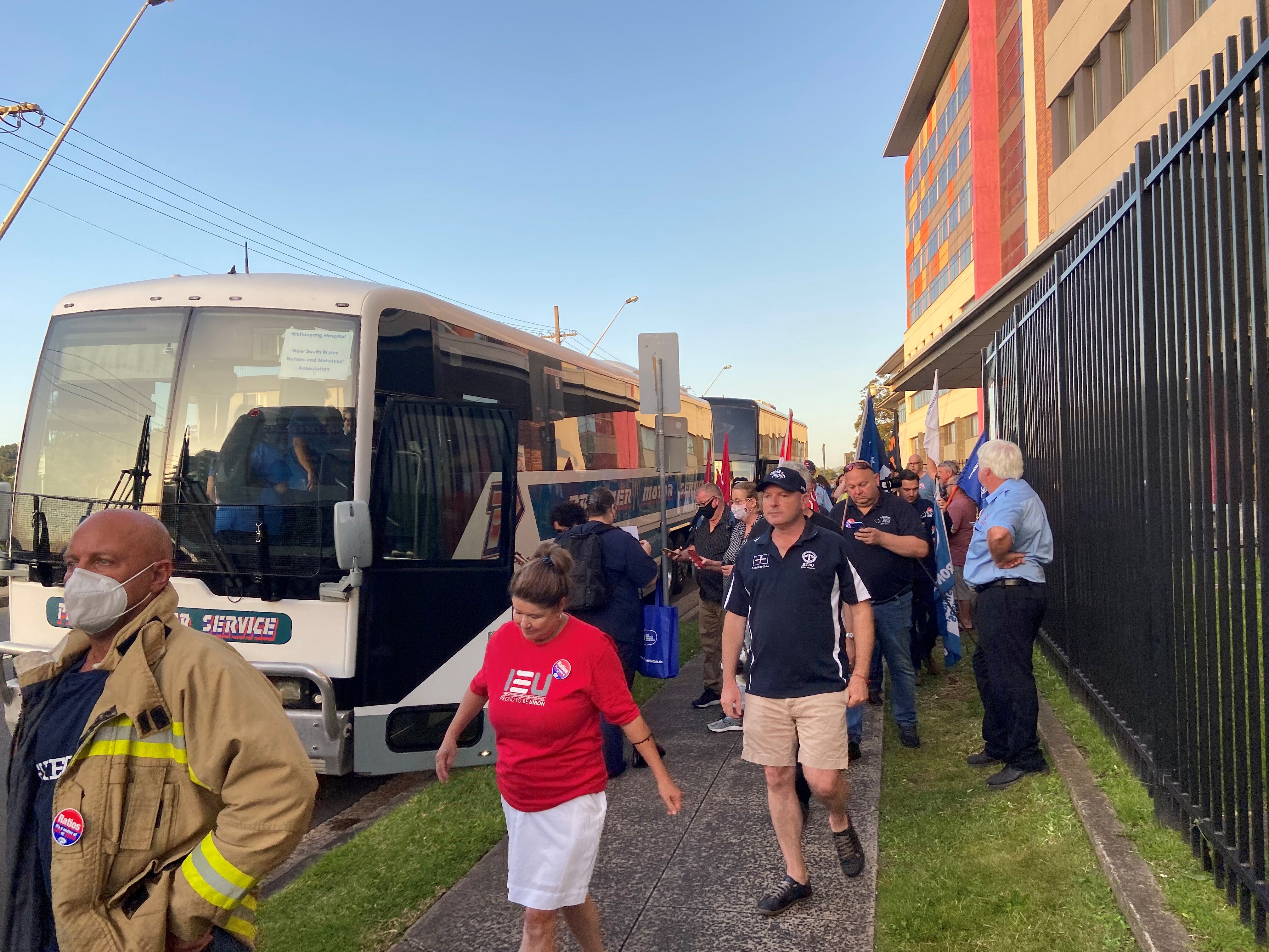 Nurses get on board a bus