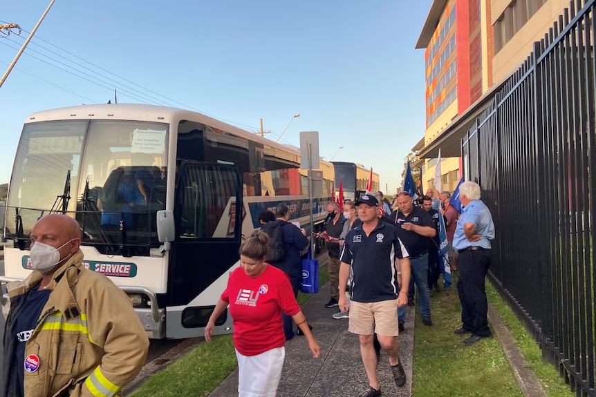 Nurses get on board a bus