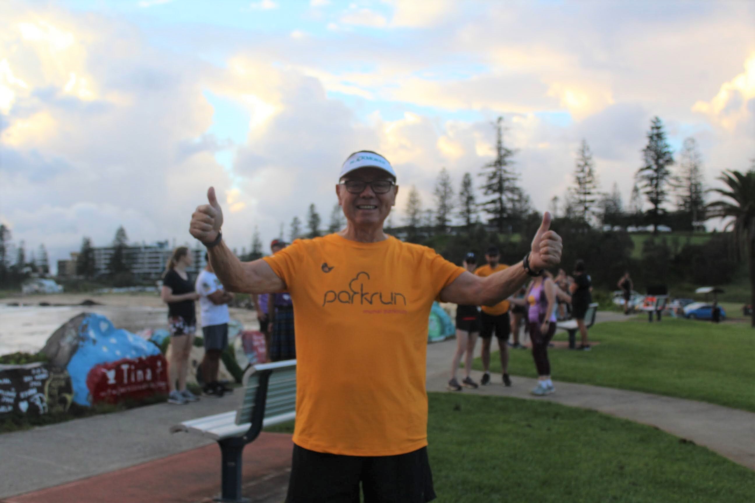 Abdon Ulloa gives two thumbs up while at parkrun.