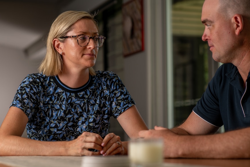 A blonde woman and Caucasian man at a dinner table