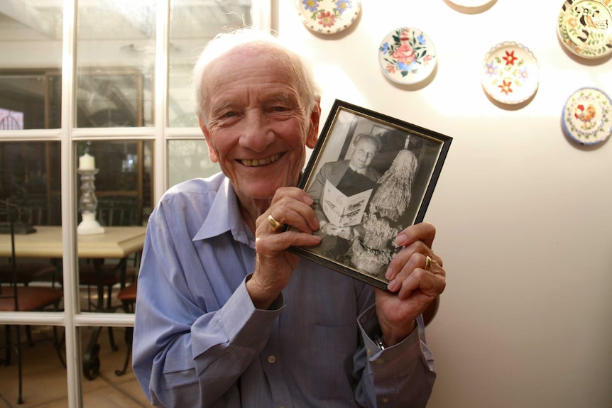 Balazs Varga with a younger photo of himself