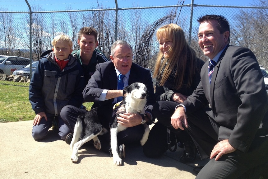 Inmates hand over trained dogs to injured war veterans with Attorney General Brad Hazzard