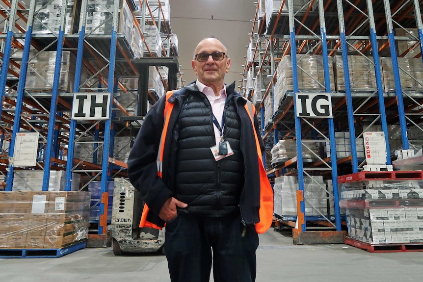 Gabor Hilton stands in his warehouse.