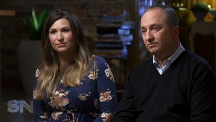Barnaby Joyce and Vikki Campion, both with serious expressions on their faces, sit for an interview in their home.