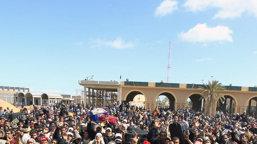 Crisis point: Egyptians fleeing the unrest in Libya wait at the border crossing of Ras Ajdir