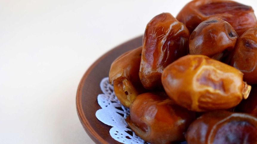 Dates on a wooden plate.