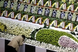 A woman mourns at a temporary group memorial altar in Ansan for the victims of the sunken passenger ship Sewol.