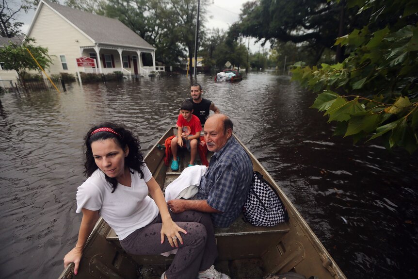 Residents are rescued from their flooded house in Slidell, Louisiana.