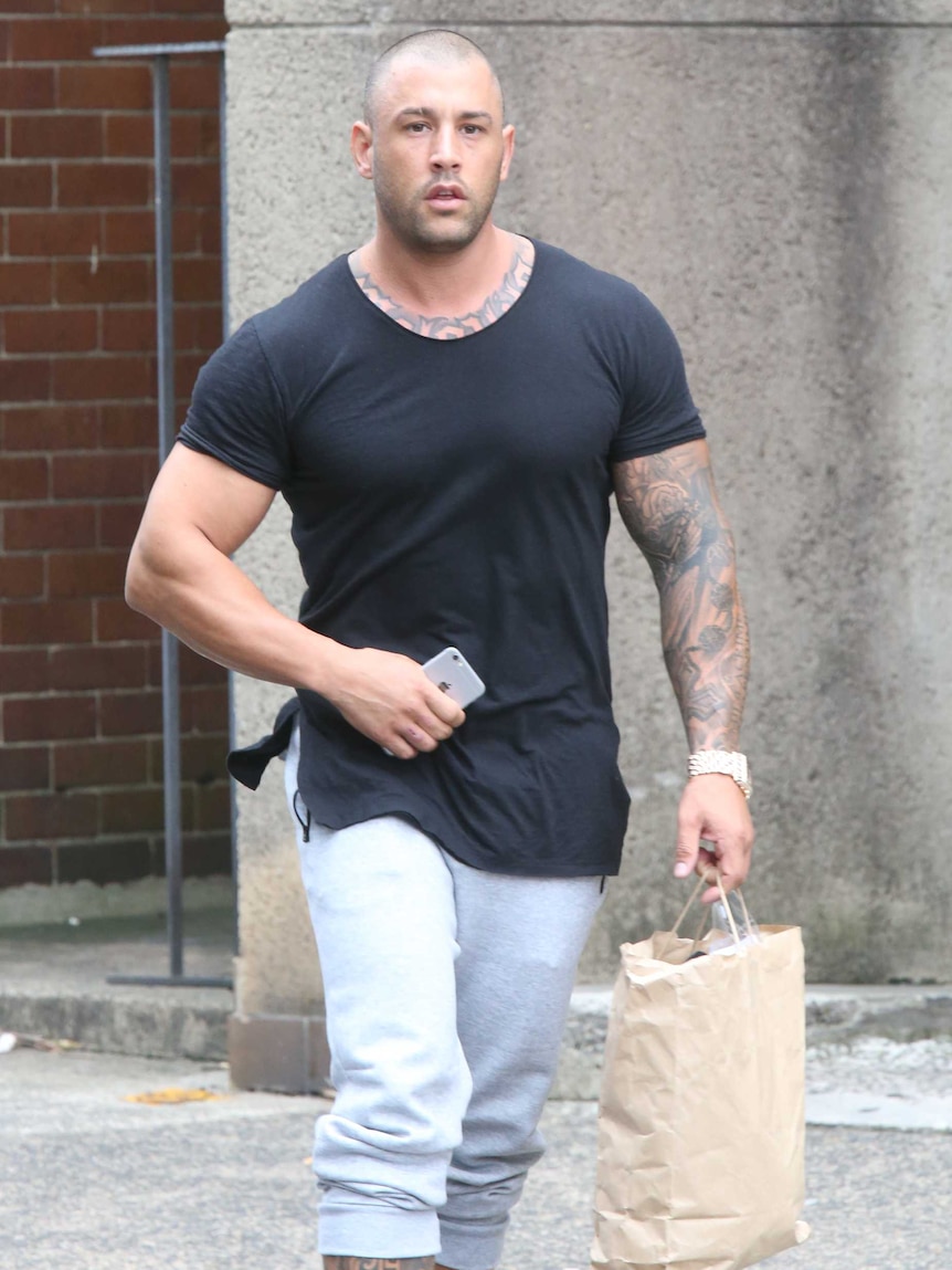 Pasquale Barbaro walking outside Newtown Police station