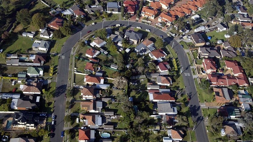 Houses sit in a residential street in the western suburbs of Sydney