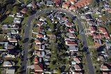 Houses sit in a residential street in the western suburbs of Sydney