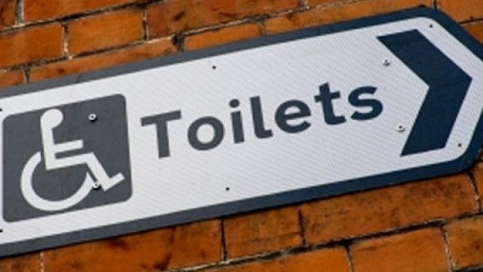toilets sign on wall