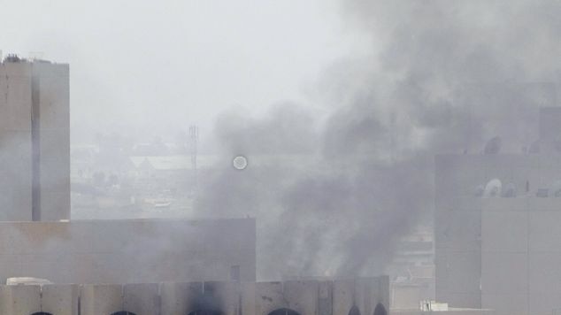 Smoke billows from the Justice Ministry in central Baghdad following the explosion.