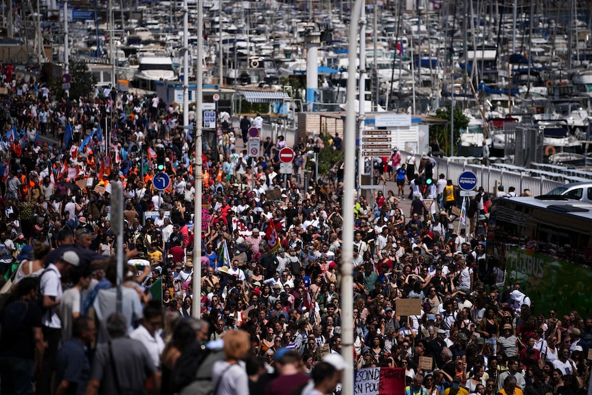 Large crowds of hundreds of protesters marching in Marseille.