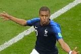 France's Kylian Mbappe wheels away against Argentina