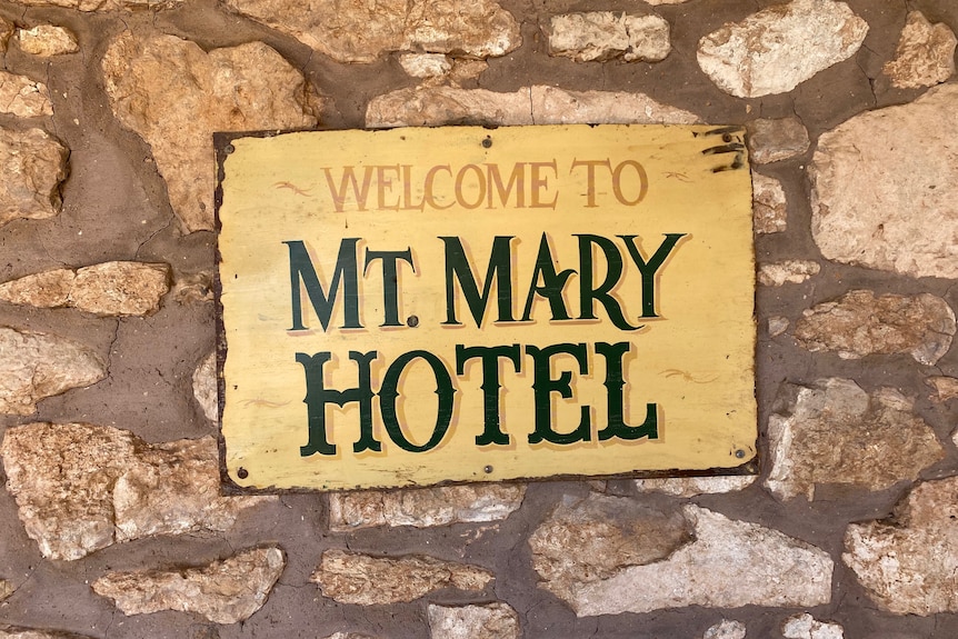 A sign which reads "welcome to Mount Mary Hotel" 