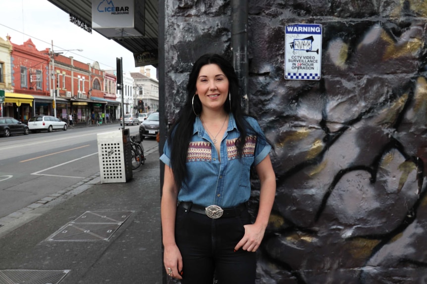 Rose Gaumann on a busy street in Fitzroy, a popular evening destination in Melbourne.