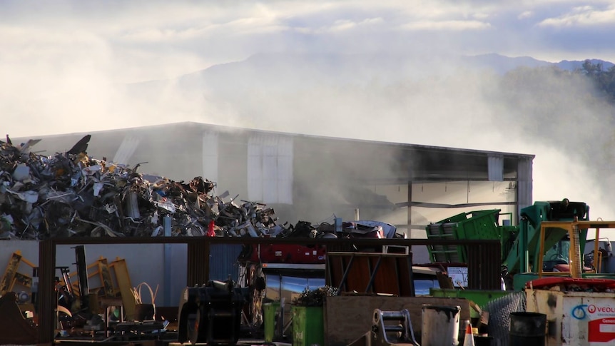 Smoke rises from a Recycal warehouse.