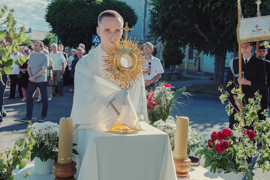 A scene from the film Corpus Christi with a young man in priest's clothes