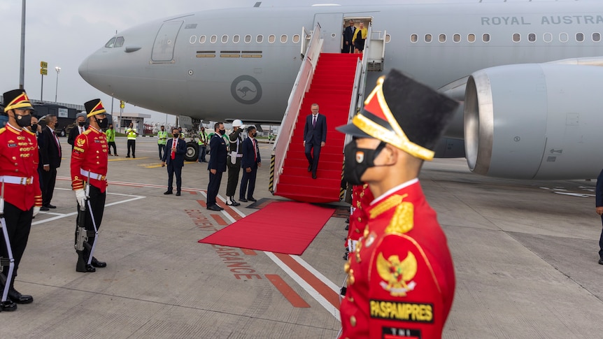 Mr Albanese deboarding the plane.