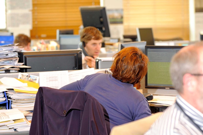 Workers in an office in Canberra.