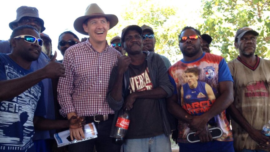 NT Chief Minister Michael Gunner poses with locals in regional NT.