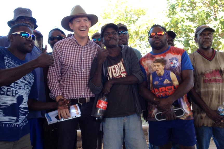 NT Chief Minister Michael Gunner poses with locals in regional NT.