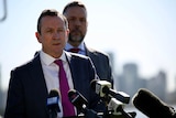 WA Premier Mark McGowan with the city behind him