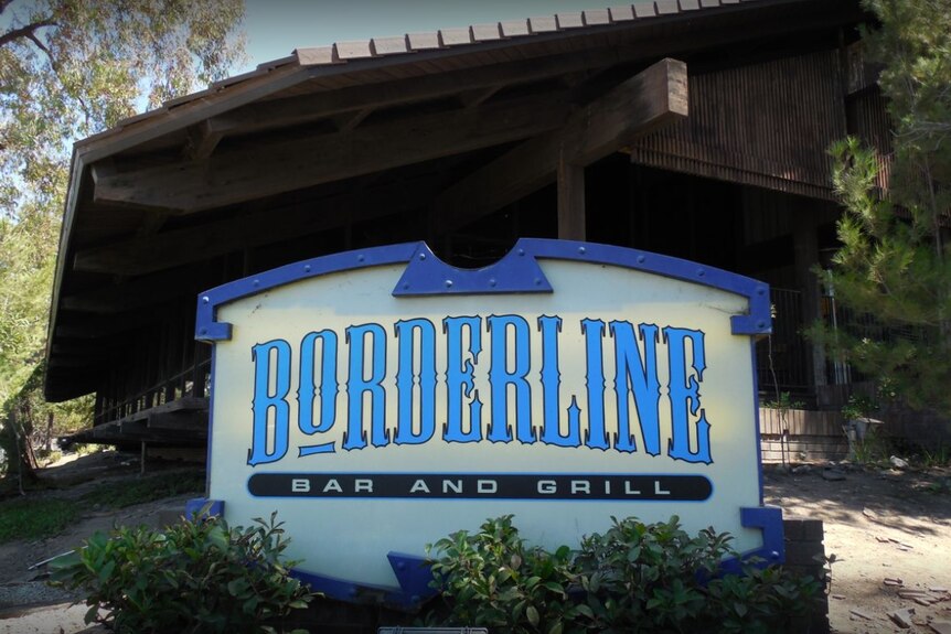 A sign saying Borderline Bar and Grill.
