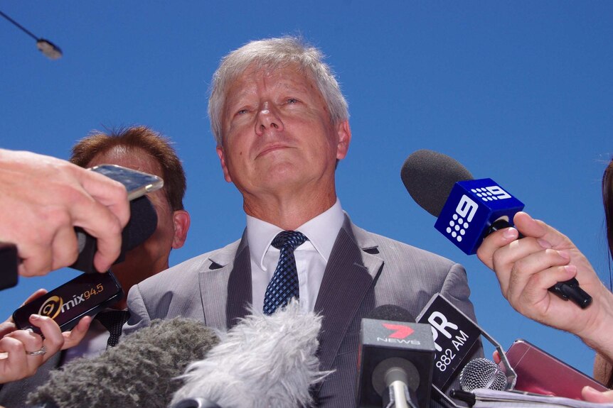 A head and shoulders shot of Bill Marmion at a media conference.