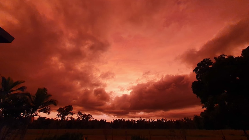 A red-and-orange-coloured sunrise