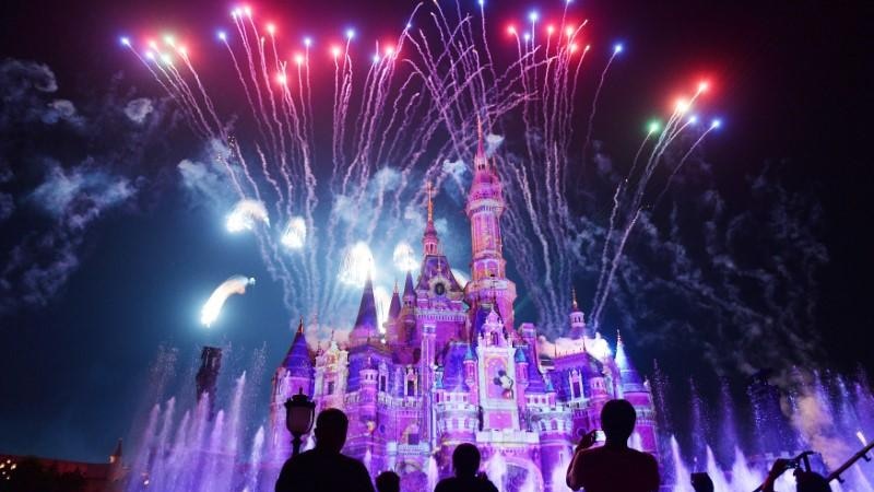 Fireworks explode over Shanghai Disney Resort at night time.