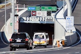 Vehicles enter the Airport Link tunnel at Stafford Road, Kedron.