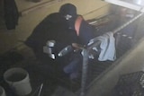 burglar stealing restaurant safe