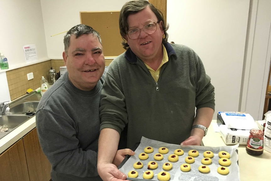 Volunteers Ray Taylor and David Brown with a tray of jam drops