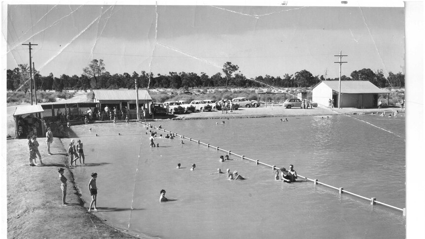 An old black and white photos show the community swimming at Barmedman Pool in the 1990s.