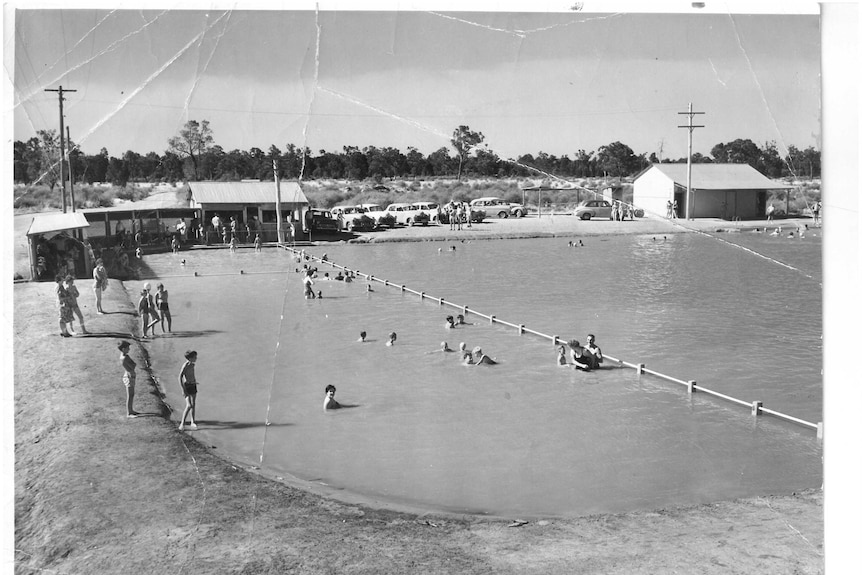 An old black and white photos show the community swimming at Barmedman Pool in the 1990s.