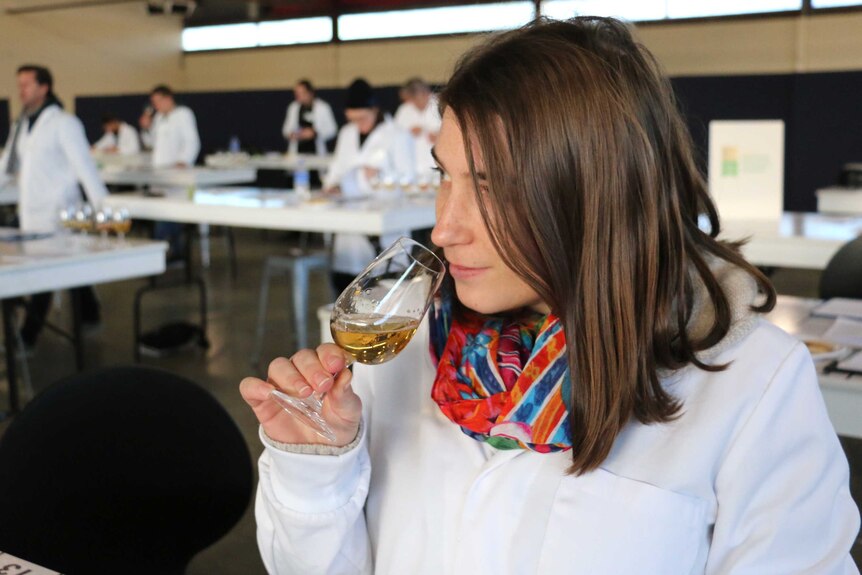 Florine Jourdain sniffs a beer glass at the 2016 Perth Royal Beer Show.