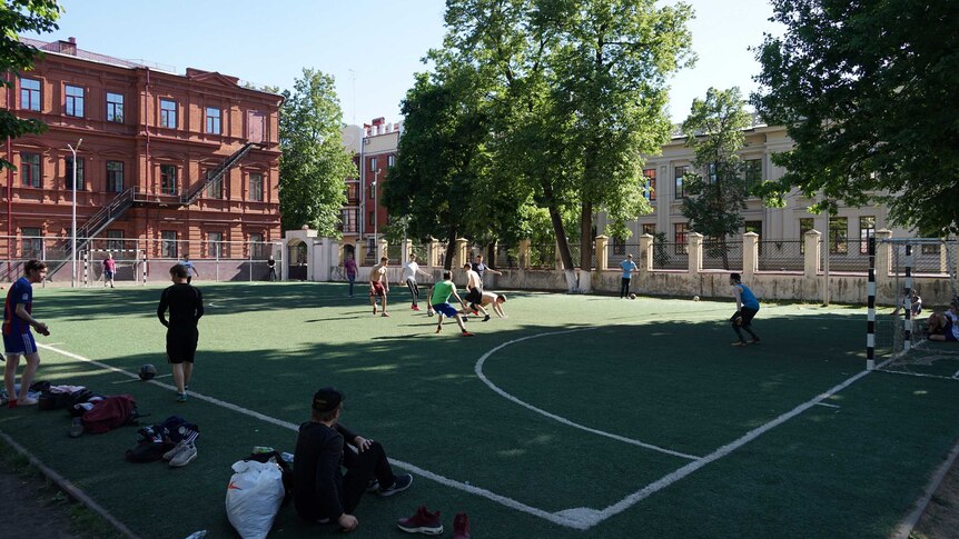 A group of young men play pick-up football in Kazan.