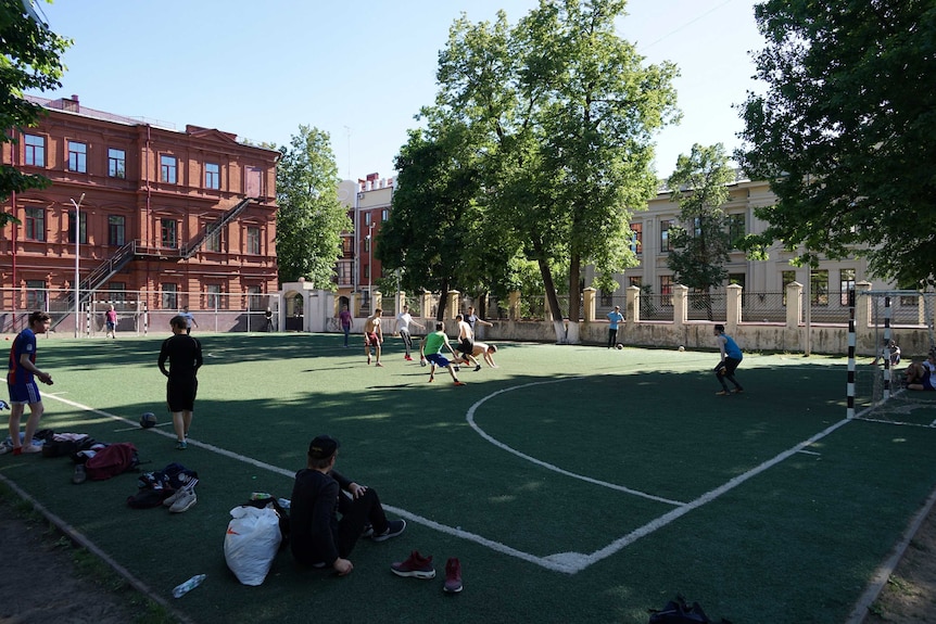 A group of young men play pick-up football in Kazan.